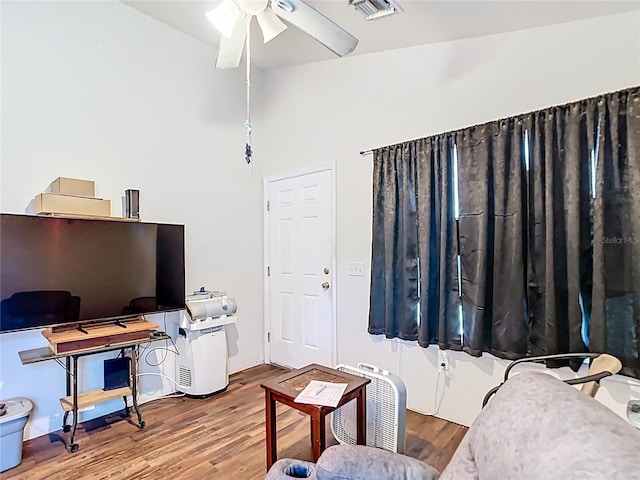 6710 Winkles St, Coleman, FL 33521 - living area featuring a ceiling fan and wood finished floors