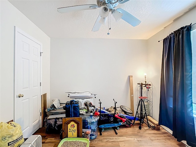 6710 Winkles St, Coleman, FL 33521 - game room with ceiling fan, wood finished floors, and a textured ceiling