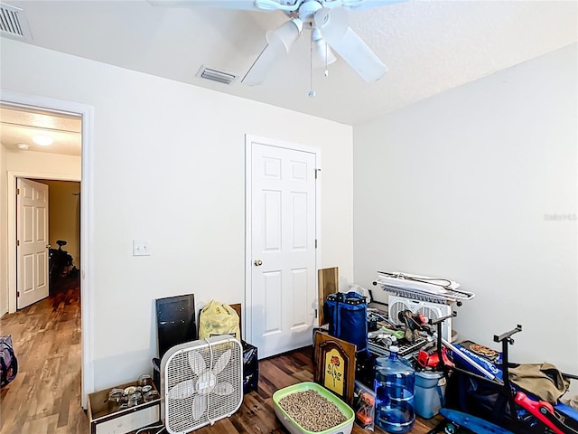 6710 Winkles St, Coleman, FL 33521 - interior space featuring wood finished floors and a ceiling fan