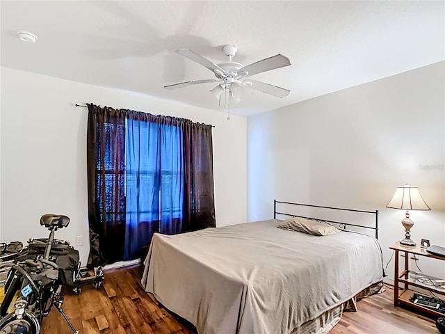 6710 Winkles St, Coleman, FL 33521 - bedroom featuring wood finished floors and ceiling fan