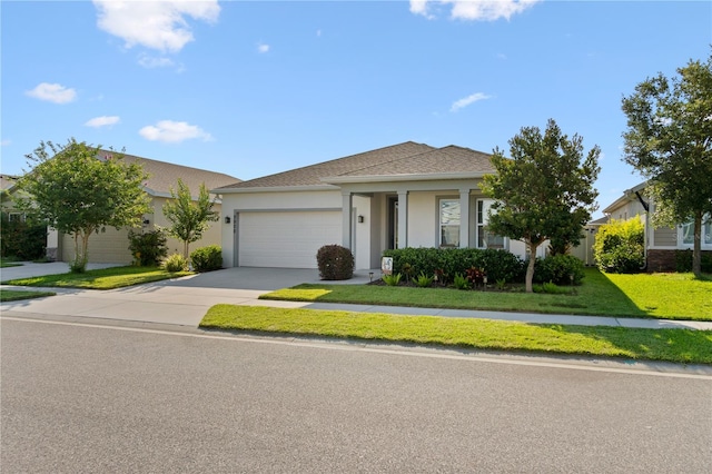2928 Marlberry Ln, Clermont, FL 34714 - view of front of home featuring a garage, driveway, stucco siding, and a front yard