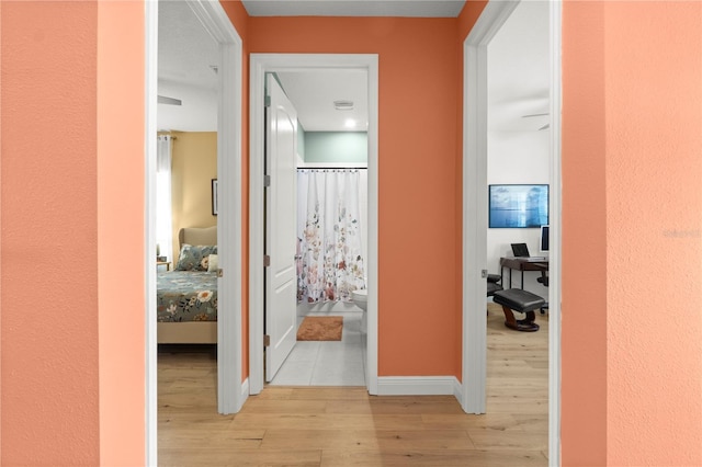 2928 Marlberry Ln, Clermont, FL 34714 - corridor featuring light wood finished floors and baseboards