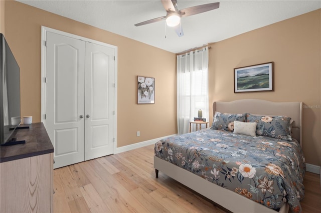 2928 Marlberry Ln, Clermont, FL 34714 - bedroom with light wood-type flooring, baseboards, a ceiling fan, and a closet