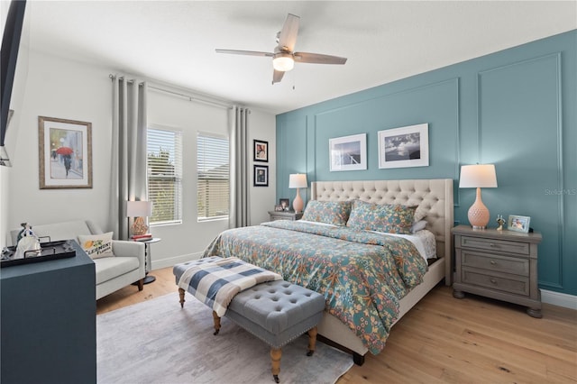 2928 Marlberry Ln, Clermont, FL 34714 - bedroom featuring light wood finished floors, a ceiling fan, and baseboards