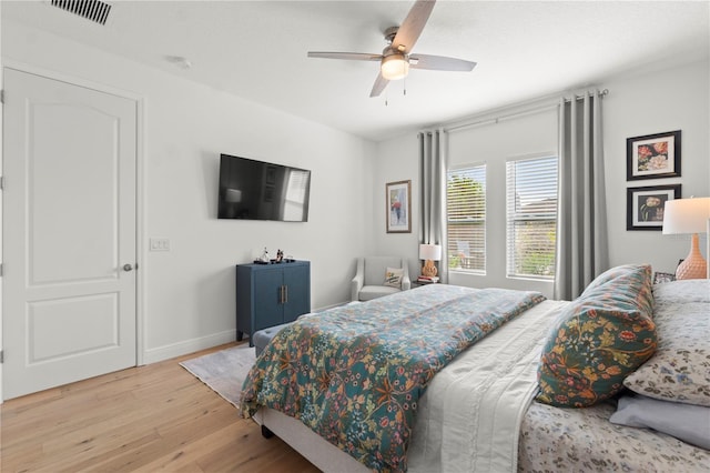 2928 Marlberry Ln, Clermont, FL 34714 - bedroom with wood finished floors, baseboards, and a ceiling fan