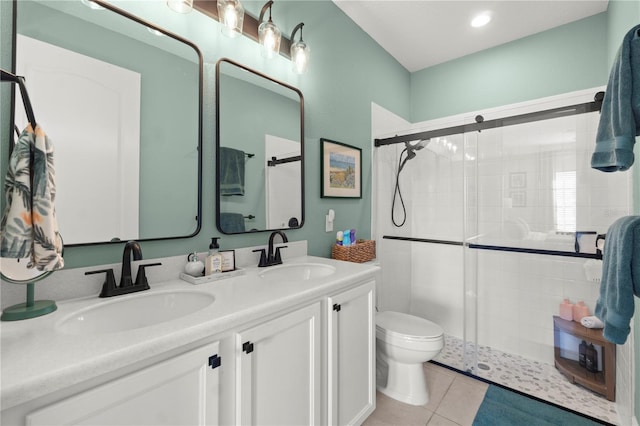 2928 Marlberry Ln, Clermont, FL 34714 - full bath with a stall shower, toilet, tile patterned flooring, and double vanity