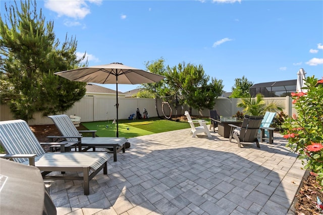 2928 Marlberry Ln, Clermont, FL 34714 - fenced backyard featuring a patio and a putting area