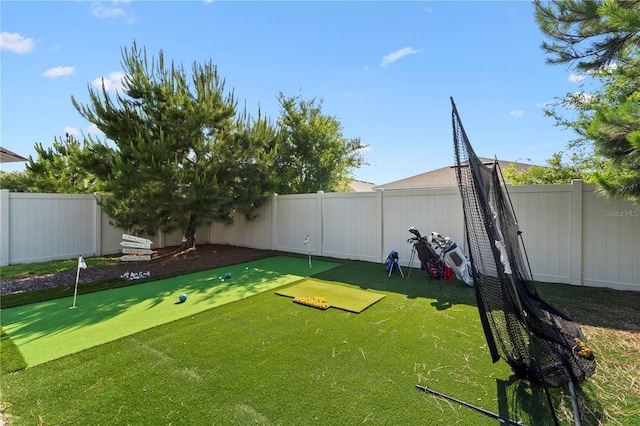 2928 Marlberry Ln, Clermont, FL 34714 - fenced backyard featuring a putting green