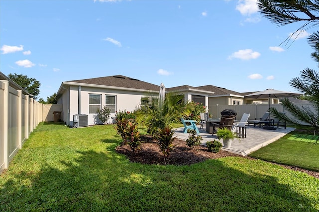 2928 Marlberry Ln, Clermont, FL 34714 - rear view of property with cooling unit, stucco siding, and a patio area