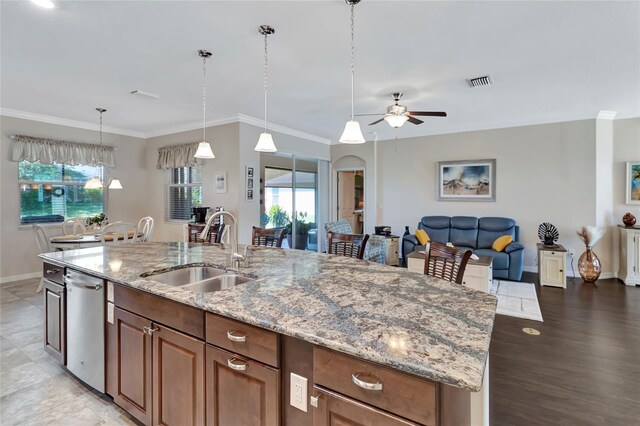4716 Heritage Trl, Leesburg, FL 34748 - kitchen with a sink, baseboards, a ceiling fan, dishwasher, and plenty of natural light