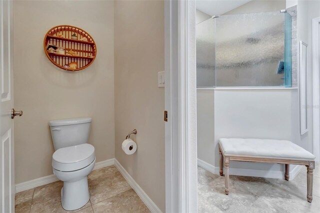 4716 Heritage Trl, Leesburg, FL 34748 - bathroom with toilet, tile patterned floors, a shower, and baseboards