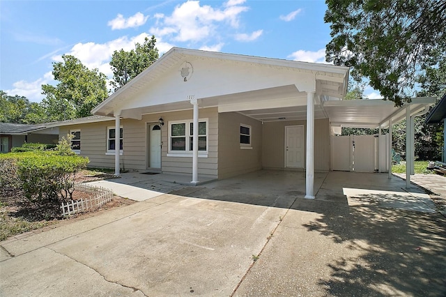 1805 Jefferson Dr, Mount Dora, FL 32757 - view of front facade featuring driveway and a carport