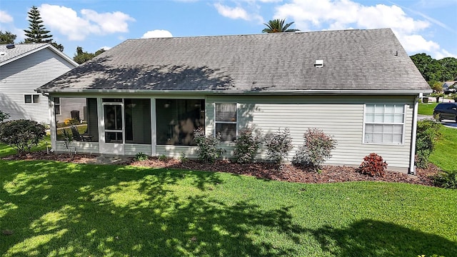 25406 Crestwater Dr, Leesburg, FL 34748 - rear view of house with a lawn, a sunroom, and roof with shingles