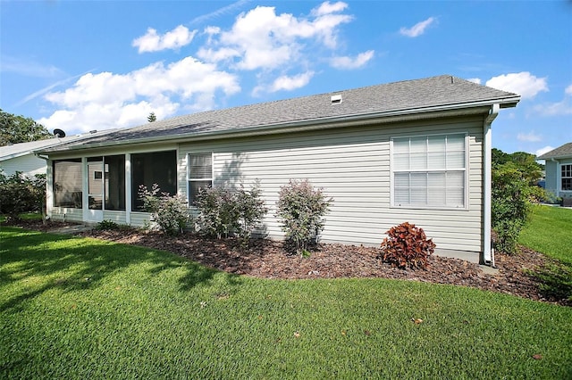 25406 Crestwater Dr, Leesburg, FL 34748 - rear view of property with a lawn, a sunroom, and a shingled roof