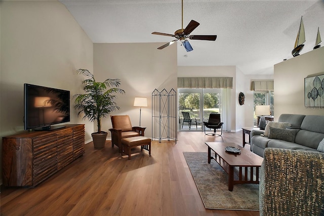 25406 Crestwater Dr, Leesburg, FL 34748 - living area with lofted ceiling, wood finished floors, a ceiling fan, and baseboards