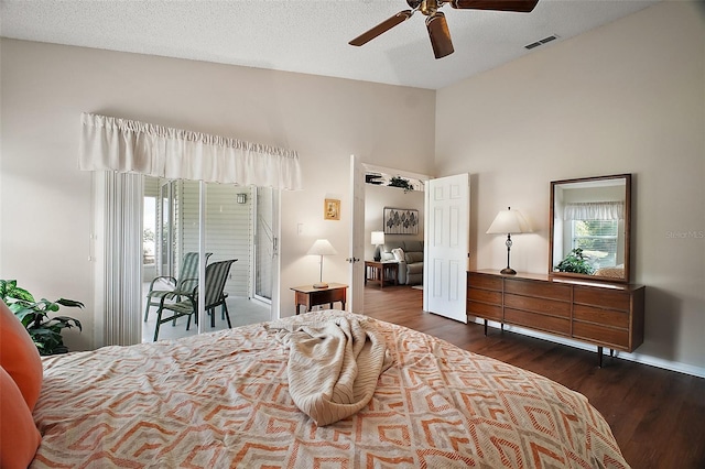 25406 Crestwater Dr, Leesburg, FL 34748 - bedroom featuring wood finished floors, lofted ceiling, multiple windows, baseboards, and a ceiling fan