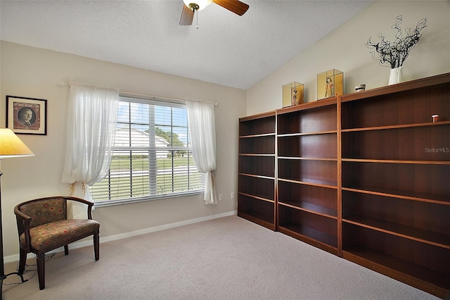 25406 Crestwater Dr, Leesburg, FL 34748 - living area with a textured ceiling, a ceiling fan, carpet, baseboards, and vaulted ceiling