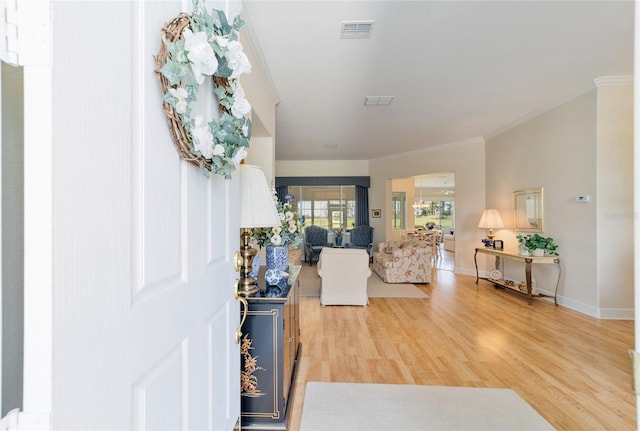 13165 SE 93rd Cir, Summerfield, FL 34491 - foyer with crown molding, light wood-style flooring, and baseboards