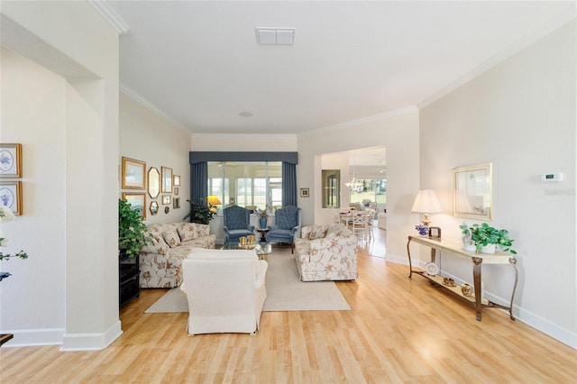 13165 SE 93rd Cir, Summerfield, FL 34491 - living area with light wood finished floors, crown molding, and baseboards