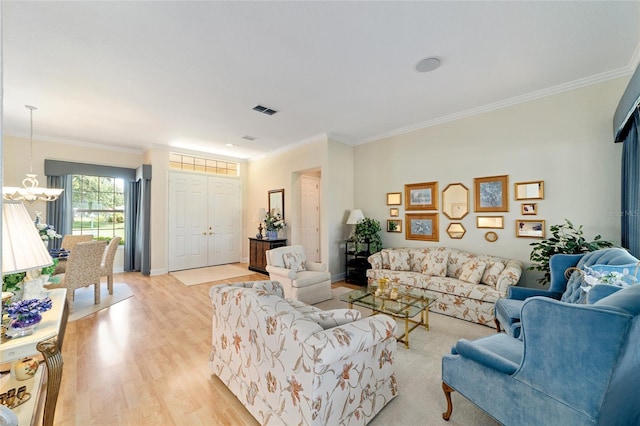 13165 SE 93rd Cir, Summerfield, FL 34491 - living area with a chandelier, light wood-type flooring, and crown molding