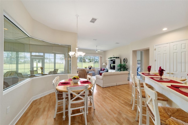 13165 SE 93rd Cir, Summerfield, FL 34491 - dining area featuring light wood-style floors, a chandelier, recessed lighting, and baseboards