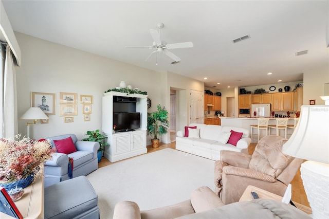 13165 SE 93rd Cir, Summerfield, FL 34491 - living area with a ceiling fan, light wood-style floors, and recessed lighting