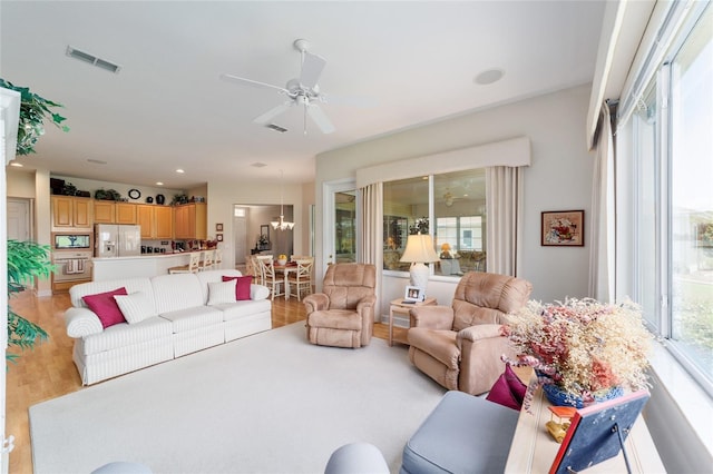 13165 SE 93rd Cir, Summerfield, FL 34491 - living room with a ceiling fan, light wood-style flooring, and recessed lighting