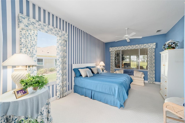 13165 SE 93rd Cir, Summerfield, FL 34491 - bedroom with wallpapered walls, baseboards, carpet, and ceiling fan