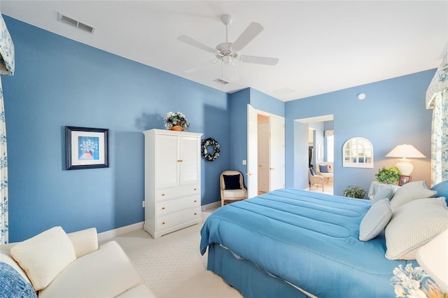 13165 SE 93rd Cir, Summerfield, FL 34491 - bedroom featuring light carpet, ceiling fan, and baseboards