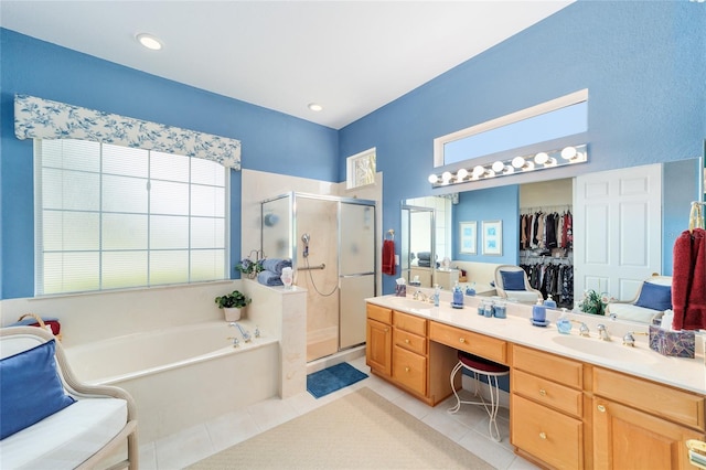 13165 SE 93rd Cir, Summerfield, FL 34491 - bathroom with tile patterned flooring, a bath, a stall shower, double vanity, and healthy amount of natural light