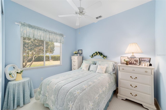13165 SE 93rd Cir, Summerfield, FL 34491 - bedroom with light colored carpet, baseboards, and ceiling fan