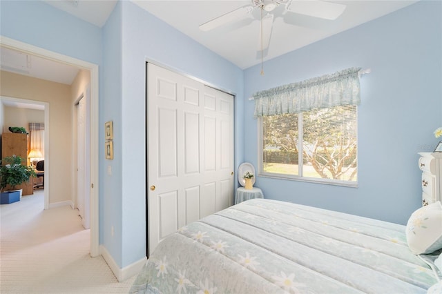 13165 SE 93rd Cir, Summerfield, FL 34491 - carpeted bedroom featuring a closet, baseboards, and a ceiling fan