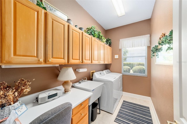 13165 SE 93rd Cir, Summerfield, FL 34491 - laundry room with independent washer and dryer, cabinet space, baseboards, light tile patterned floors, and a desk