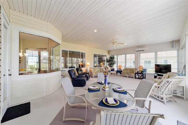 13165 SE 93rd Cir, Summerfield, FL 34491 - sunroom / solarium featuring a wall unit AC, a ceiling fan, and outdoor dining area