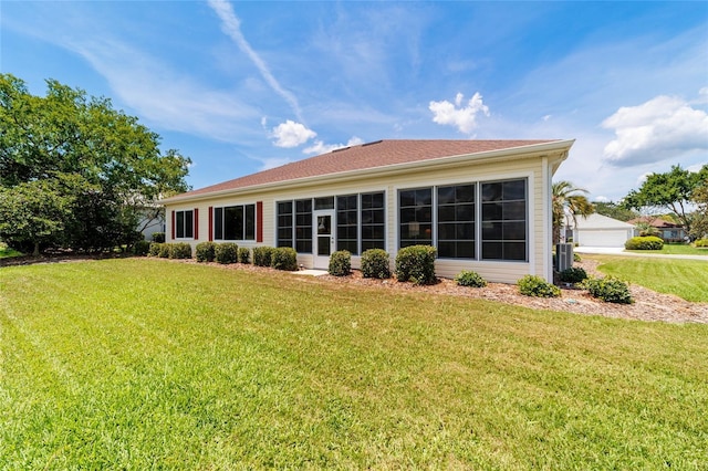 13165 SE 93rd Cir, Summerfield, FL 34491 - back of house with a yard and central AC