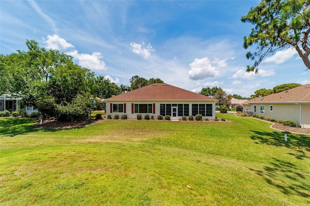 13165 SE 93rd Cir, Summerfield, FL 34491 - rear view of property featuring a yard