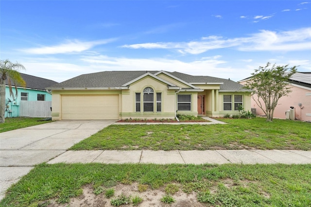 2896 Picadilly Cir, Kissimmee, FL 34747 - ranch-style home with stucco siding, an attached garage, and concrete driveway