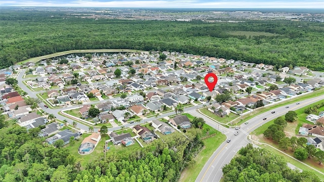 2896 Picadilly Cir, Kissimmee, FL 34747 - aerial view of property's location featuring a forest and nearby suburban area