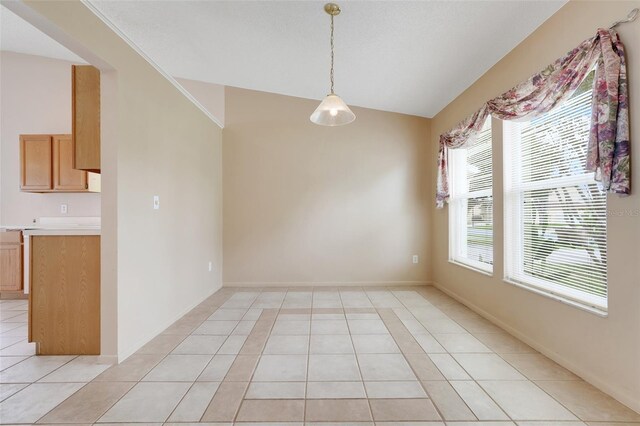 2896 Picadilly Cir, Kissimmee, FL 34747 - unfurnished dining area featuring light tile patterned floors, vaulted ceiling, and baseboards