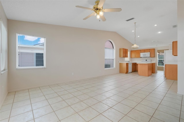 2896 Picadilly Cir, Kissimmee, FL 34747 - unfurnished living room with lofted ceiling, plenty of natural light, light tile patterned flooring, ceiling fan, and recessed lighting