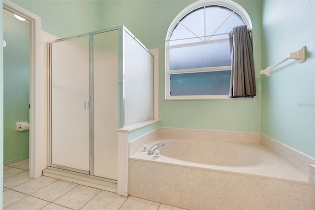 2896 Picadilly Cir, Kissimmee, FL 34747 - bathroom with a stall shower, a bath, and tile patterned floors