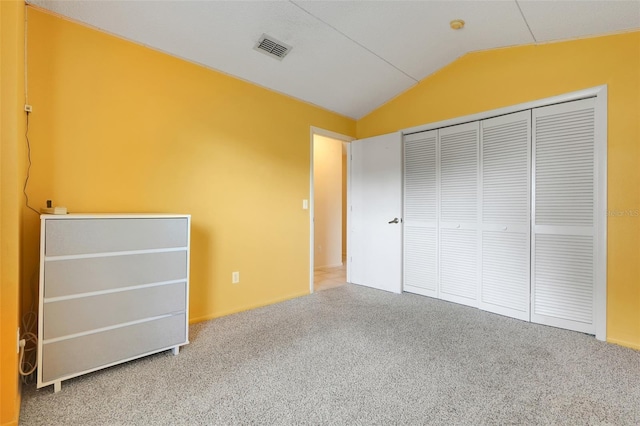 2896 Picadilly Cir, Kissimmee, FL 34747 - unfurnished bedroom with vaulted ceiling, carpet flooring, and a closet