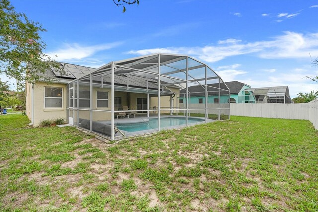2896 Picadilly Cir, Kissimmee, FL 34747 - back of house with glass enclosure, a patio, and stucco siding