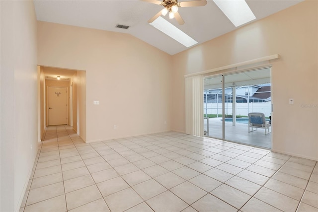 2896 Picadilly Cir, Kissimmee, FL 34747 - spare room with a skylight, vaulted ceiling, a ceiling fan, and light tile patterned floors
