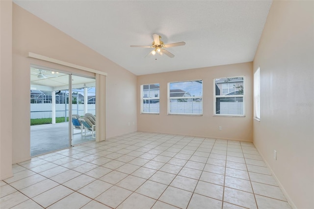 2896 Picadilly Cir, Kissimmee, FL 34747 - spare room with ceiling fan, light tile patterned flooring, and vaulted ceiling