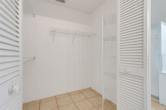 2896 Picadilly Cir, Kissimmee, FL 34747 - spacious closet with light tile patterned floors