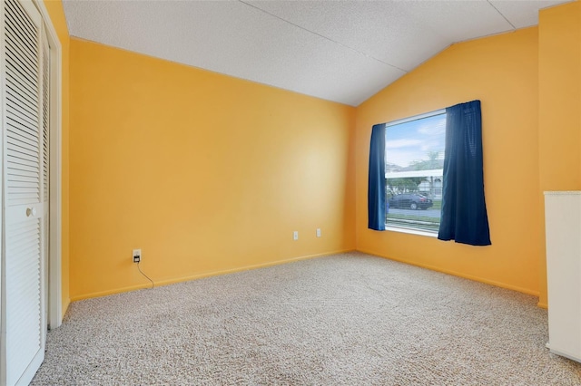 2896 Picadilly Cir, Kissimmee, FL 34747 - unfurnished bedroom with vaulted ceiling, carpet floors, and baseboards