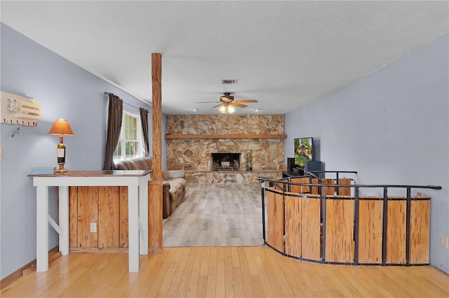 5581 SW 197th Ter, Dunnellon, FL 34431 - unfurnished living room with ceiling fan, hardwood / wood-style floors, and a fireplace