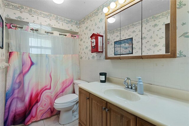 5581 SW 197th Ter, Dunnellon, FL 34431 - bathroom featuring wallpapered walls, vanity, toilet, tile walls, and curtained shower