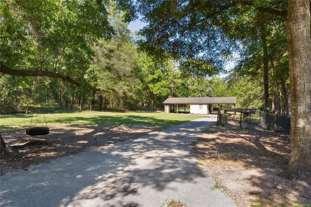 5581 SW 197th Ter, Dunnellon, FL 34431 - view of front of property with a front lawn and a detached carport